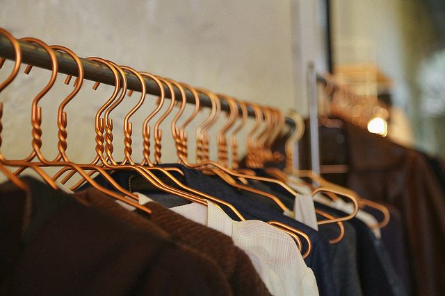 Stylish outfits on hanger